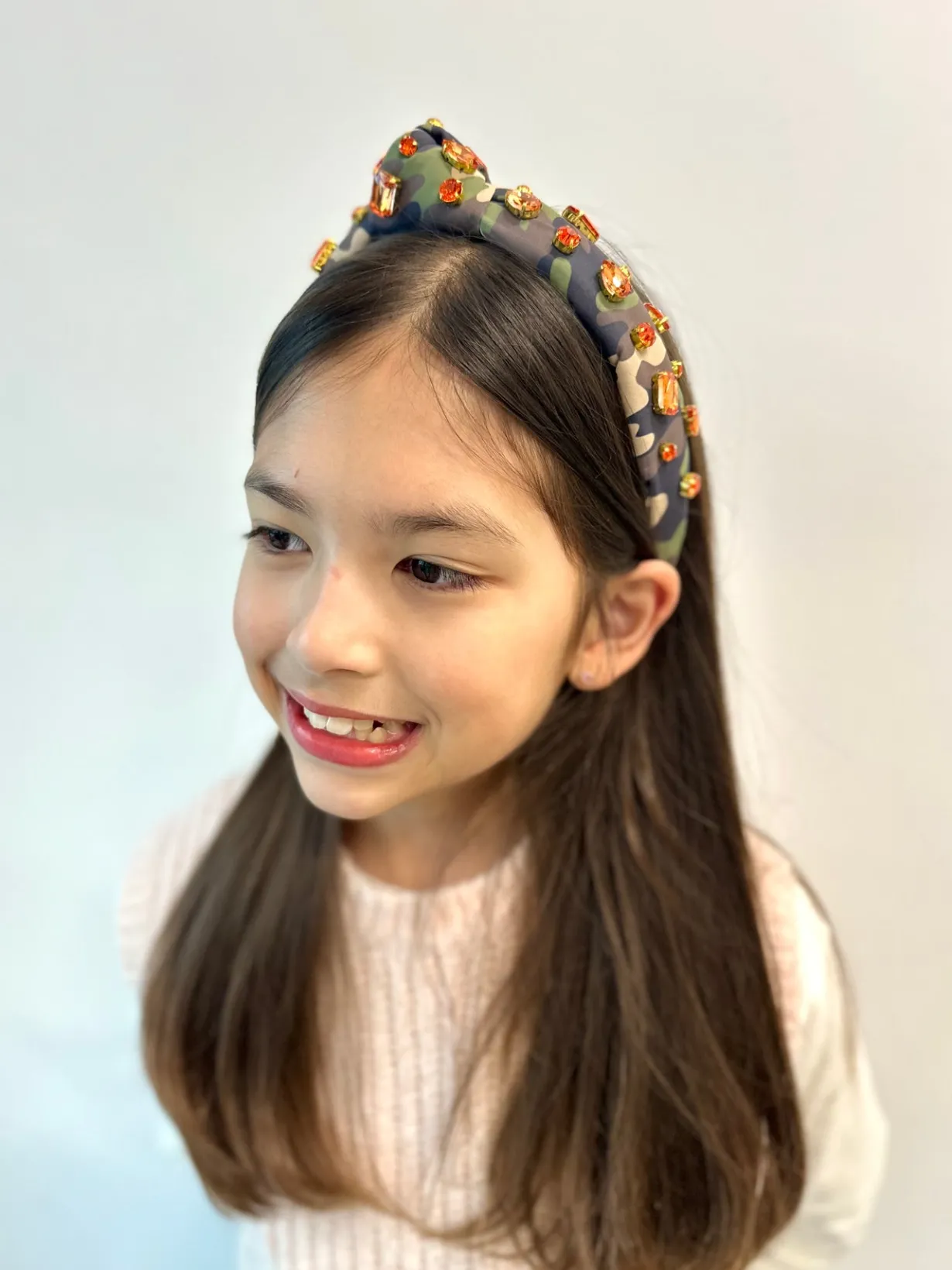 child_size_camo_headband__1.webp Child Size Camo Headband with Orange Crystals-Brianna Cannon Sale
